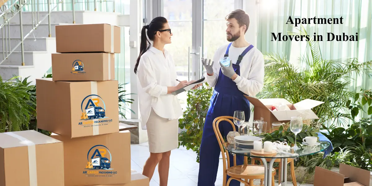 Professional apartment movers in Dubai assisting a customer with packing and relocation while handling household items and moving boxes safely.